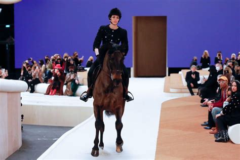 chanel sends princess on horseback down the runway in paris|Chanel jacket.